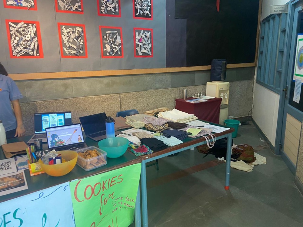 Eco-Stitch stall at school with bags and posters